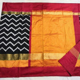 Pochampally ikkat black with orange and maroon zari border handwoven pure silk saree - Pochampally Ikkat Silk Sarees